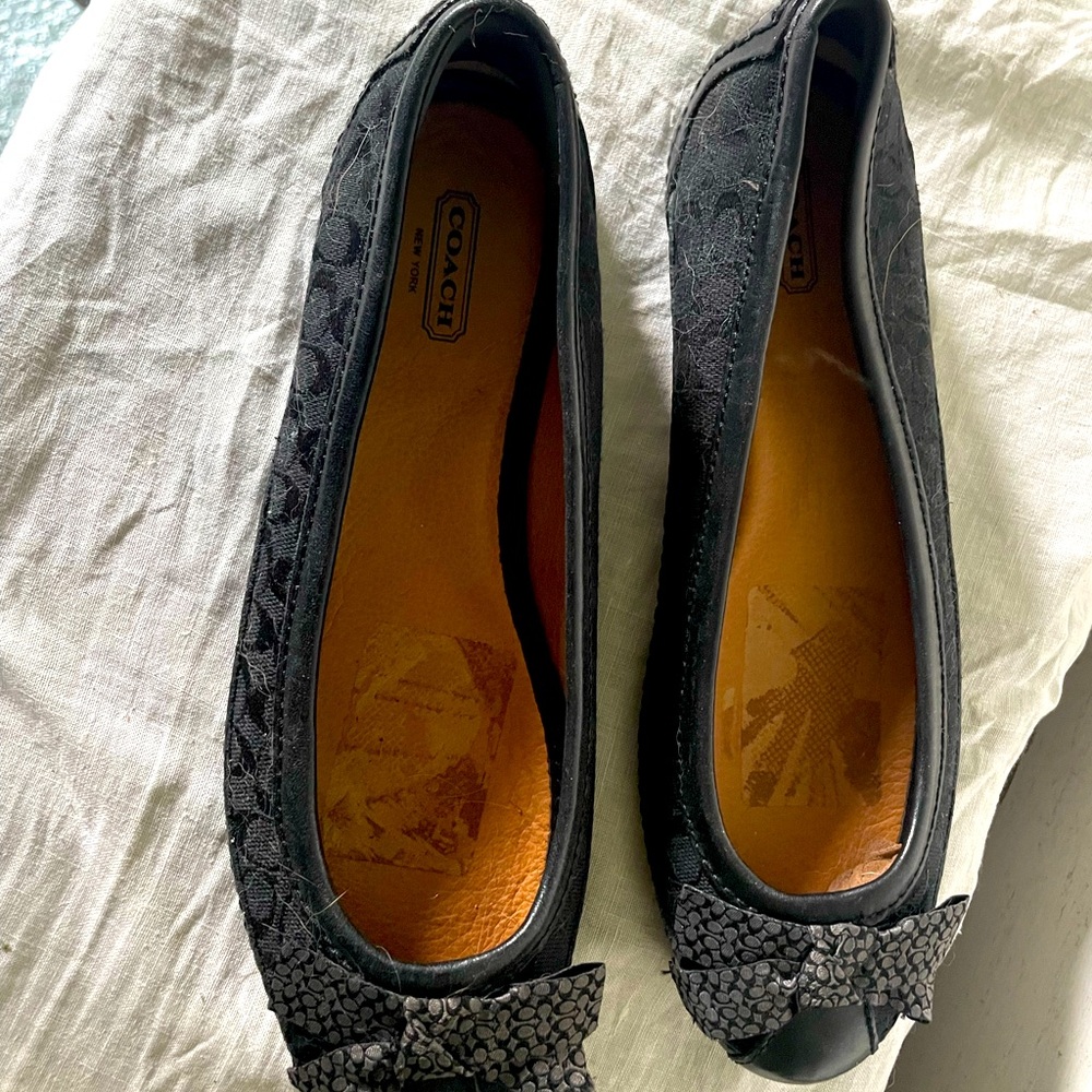 Black COACH flats. Have some slight cosmetic damage, shown in picture